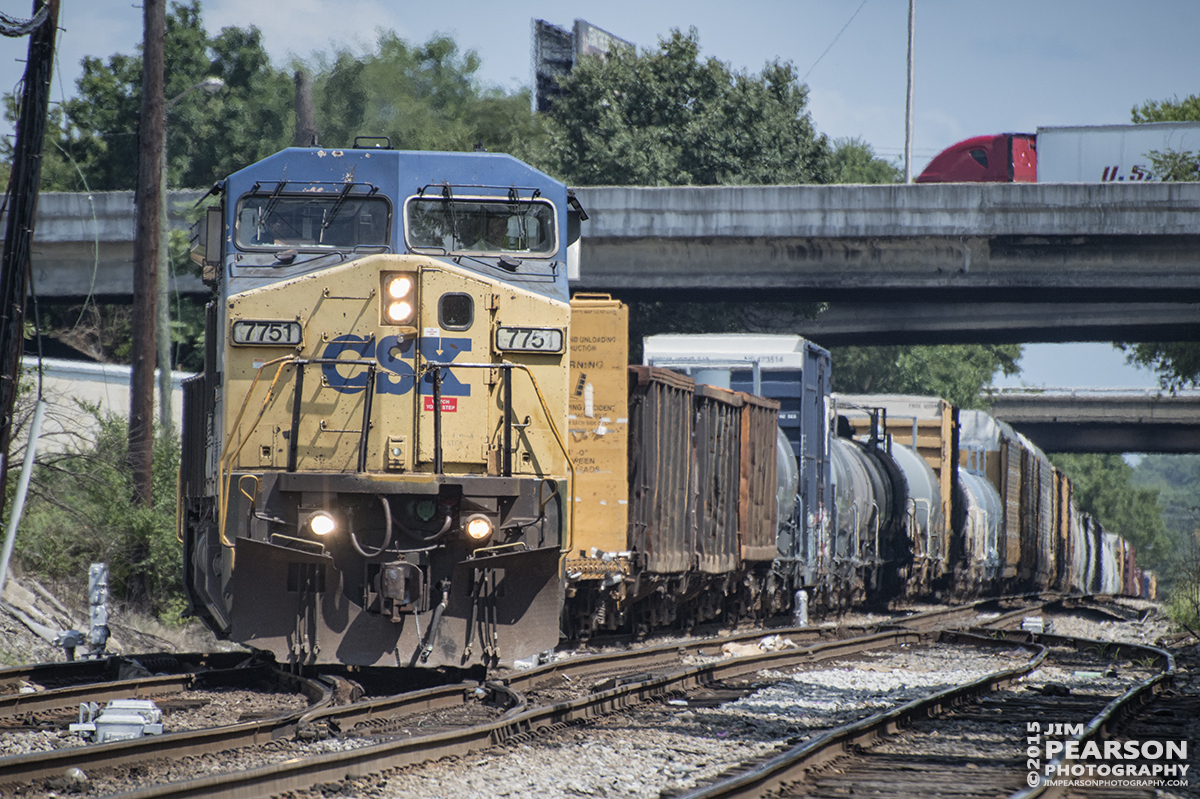 July 16, 2015 - CSX Q535 takes the cross-over as it approaches Fogg Street in Nashville, Tennessee on it's way north with engine 7751 in the lead. - Tech Info: 1/1600sec, f/5.6, ISO 500, Lens: Nikon 70-300 @ 300mm with a Nikon D800 shot and processed in RAW.