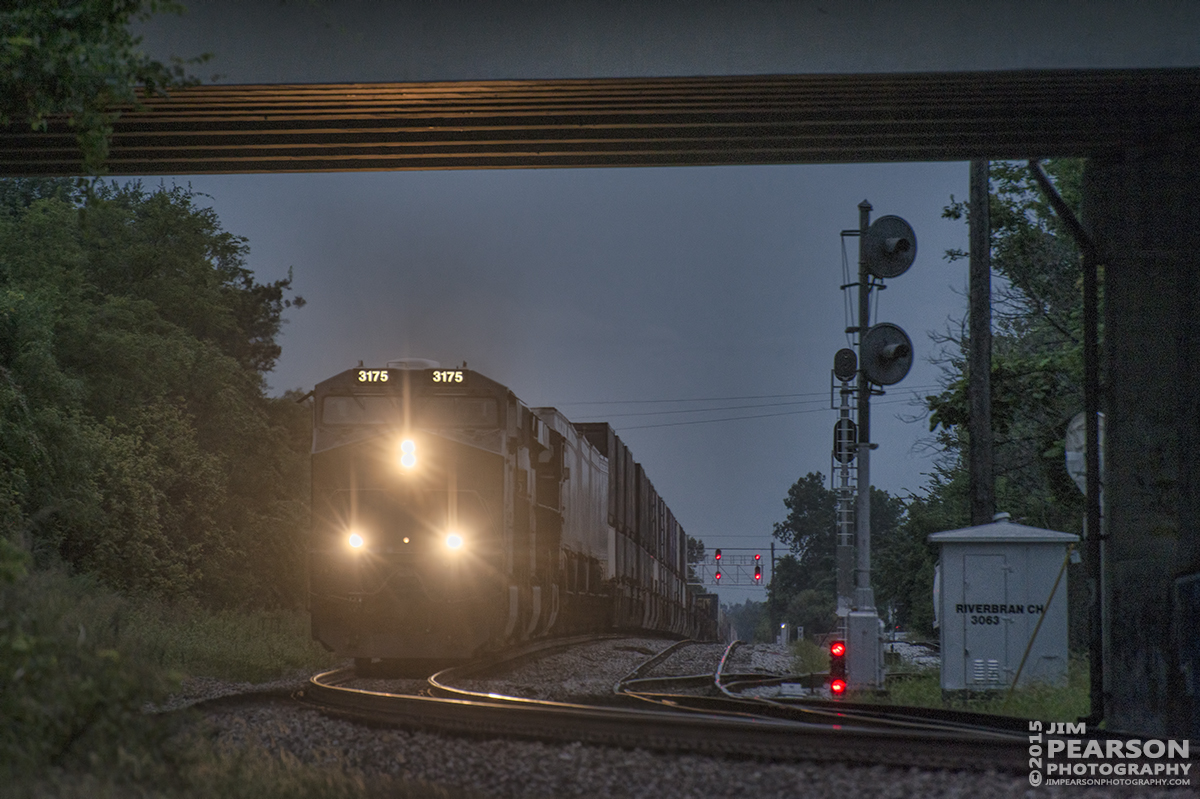 August 19, 2015 - CSX Q026 passes the signals for the River Branch line as it heads north under the 2nd Street Bridge approaching the old L&N Depot at Henderson, Ky on the Henderson Subdivision at dusk. Tech Info: 1/640sec, f/5.5, ISO 360, Lens: Nikon 70-300 @ 280mm with a Nikon D800 shot and processed in RAW.