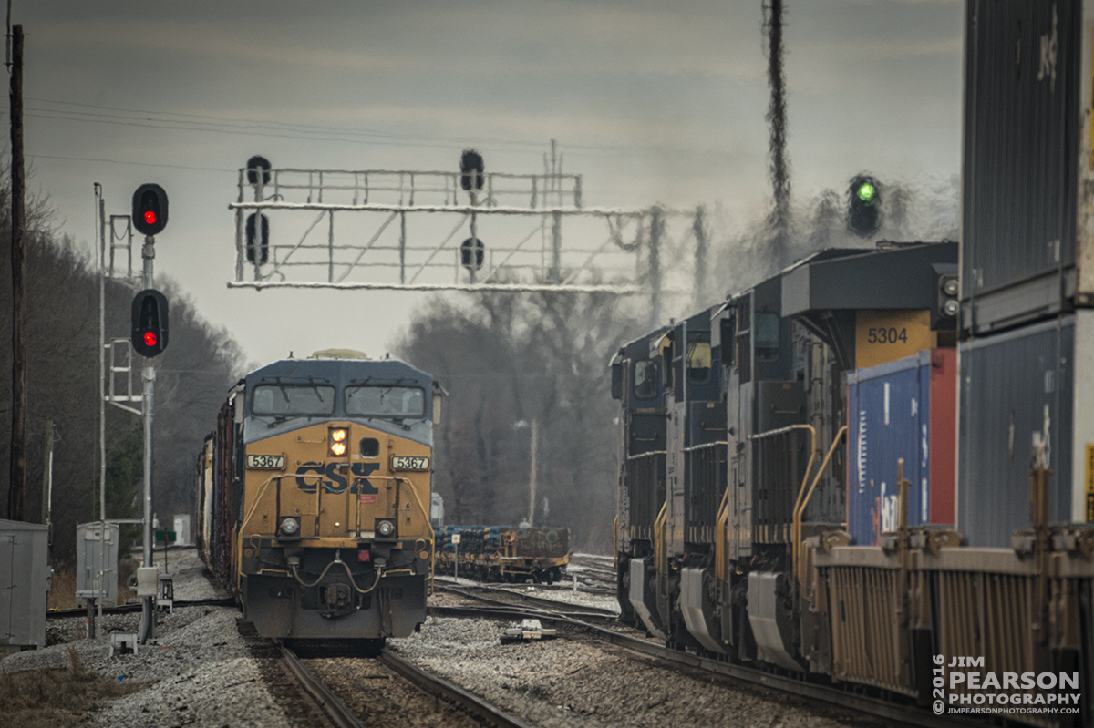 February 19, 2016 - CSX Q592, left, waits at Guthrie, Ky as Q025-19 heads past them on its way south on the Henderson Subdivision. - Tech Info: 1/800 | f/5.6 | ISO 500 | Lens: Sigma 150-600 @ 320mm on a Nikon D800 shot and processed in RAW.