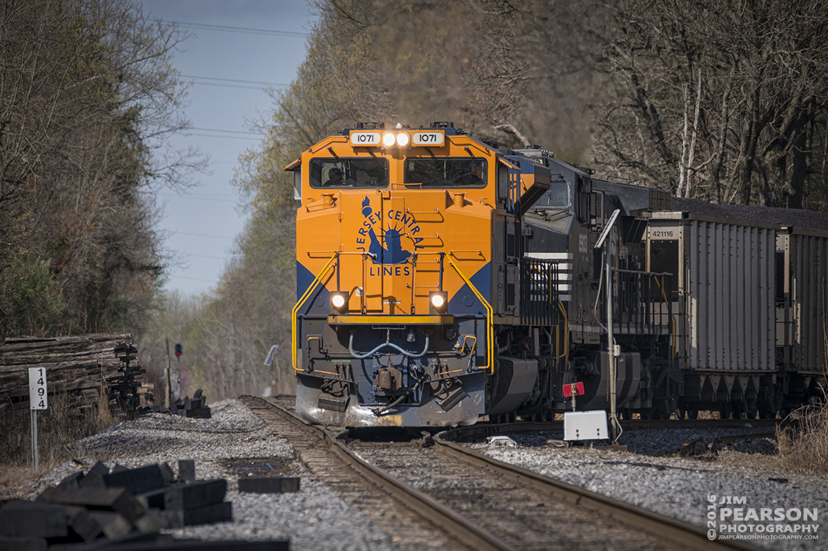 April 1, 2016 - Norfolk Southern's 1071 Heritage Unit "Jersey Central Lines" pulls out of the Warrior Coal Mine Lead onto Paducah and Louisville Railways Main line at Madisonville, Ky as it begins it's northbound trip to Louisville, Ky. The train tied down at Pond River, north of Madisonville till the new crew takes it on north this afternoon around 4pm CST - Tech Info: 1/2500 | f/6 | ISO 400 | Lens: Sigma 150-600 @ 370mm on a Nikon D800 shot and processed in RAW.