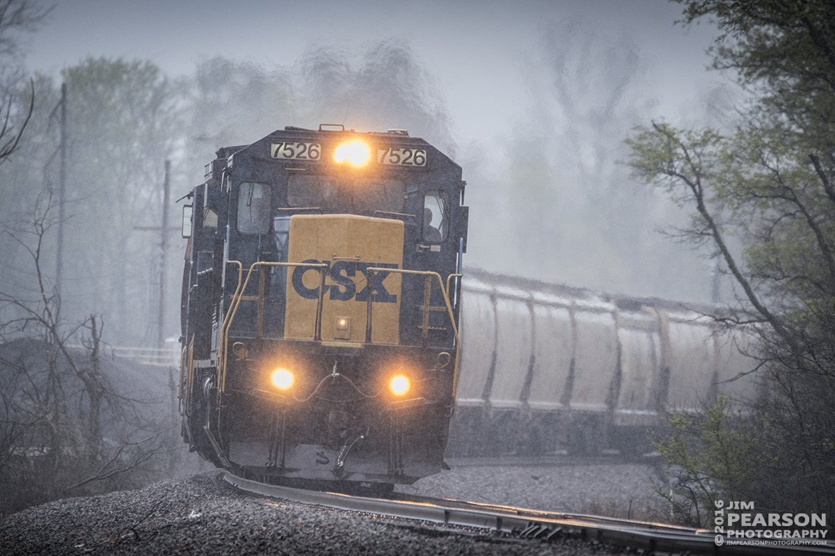 April 6, 2016 - During a late afternoon rain CSX G299-03, a loaded grain train, rounds the curve coming out of Henderson, Ky as it heads south on the Henderson Subdivision. - Tech Info: 1/500 | f/6.3 | ISO 3200 | Lens: Sigma 150-600 @ 600mm on a Nikon D800 shot and processed in RAW. ?