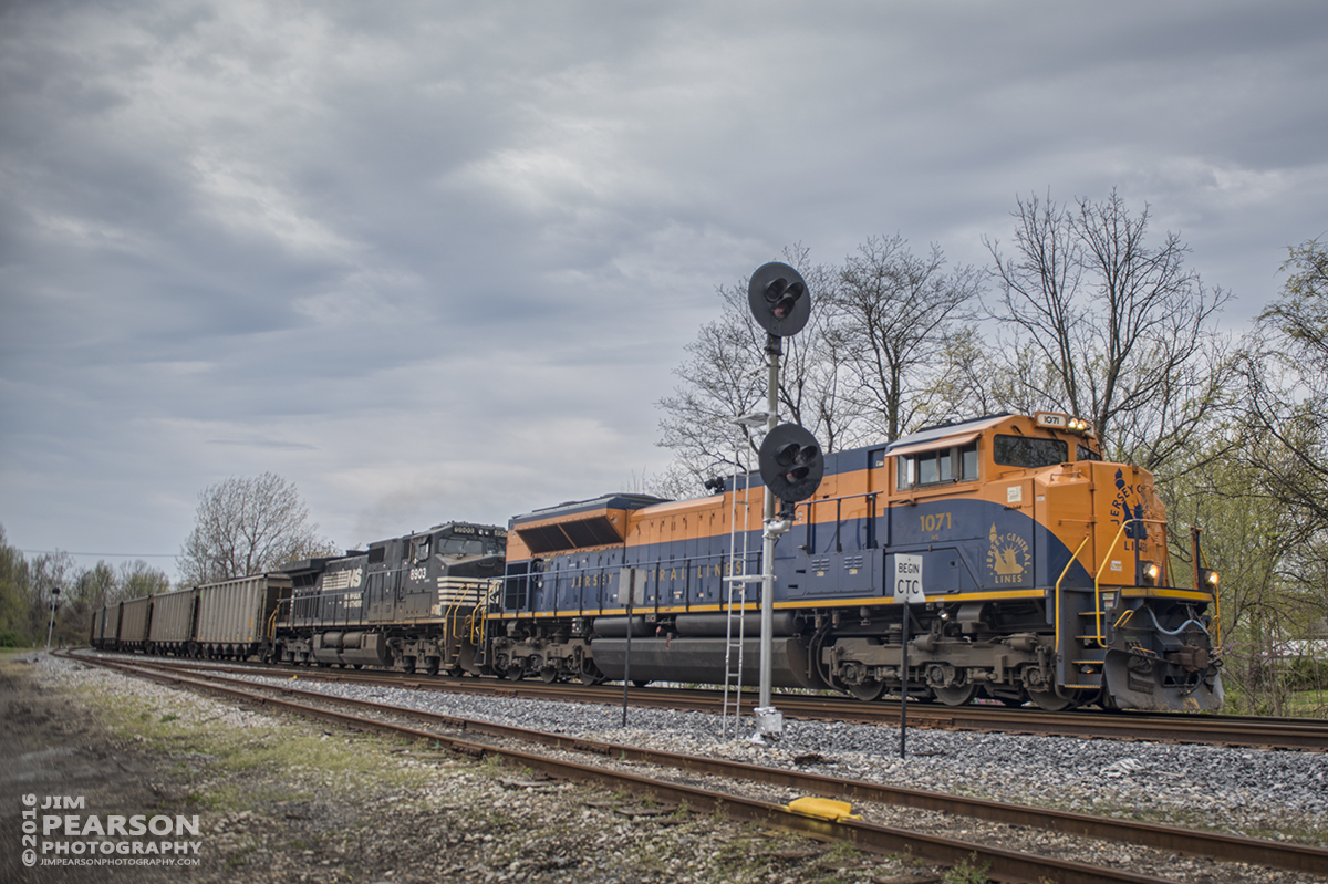 April 10, 2016 - Norfolk Southern 1071 Heritage Unit "Jersey Central Lines" passes the signals in the old IC Yard at Central City, Ky as it moves north on the Paducah and Louisville Railway to Louisville, Ky. - Tech Info: 1/500 | f/2.8 | ISO 125 | Lens: Sigma 24-70 @ 24mm on a Nikon D800 shot and processed in RAW.
