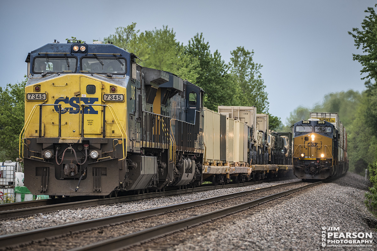 April 29, 2016 - CSX hot intermodal Q028 passes W876-26, with a loaded military train, at the north end of the siding at Slaughters, Ky on the Henderson Subdivision. - Tech Info: 1/1000 | f/5.3 | ISO 1000 | Lens: Sigma 150-600 @ 240mm on a Nikon D800 shot and processed in RAW.