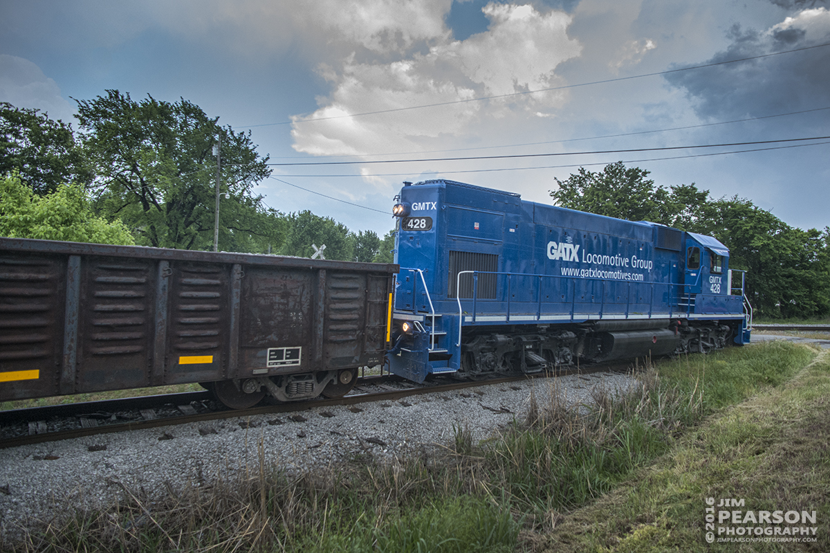 May 10, 2016 - Fredonia Valley Railroad's GATX/GMTX 428 lease unit begins to back its empty rock train the 7 miles back to Martin Marietta Materials after dropping off a load of rock at the Paducah and Louisville Railway yard in Princeton, Ky. - Tech Info: 1/800 | f/5 | ISO 1250 | Lens: Nikon 18mm on a Nikon D800 shot and processed in RAW. ?