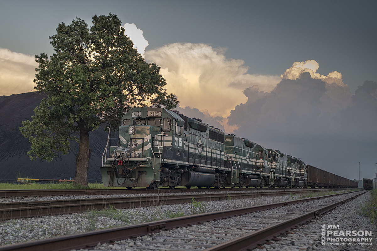 May 10, 2016 - A Paducah and Louisville Railway DPU coal train rounds the loop at the Calvert City Loadout at Calvert City, Kentucky as storm clouds pass in the distance. I think this is the first time I can recall finding a PAL train with DPU units. It had four on the front and four on the rear of the train as it moved through the loop. - Tech Info: 1/1250 | f/5 | ISO 560 | Lens: Sigma 24-70 @ 48mm on a Nikon D800 shot and processed in RAW.