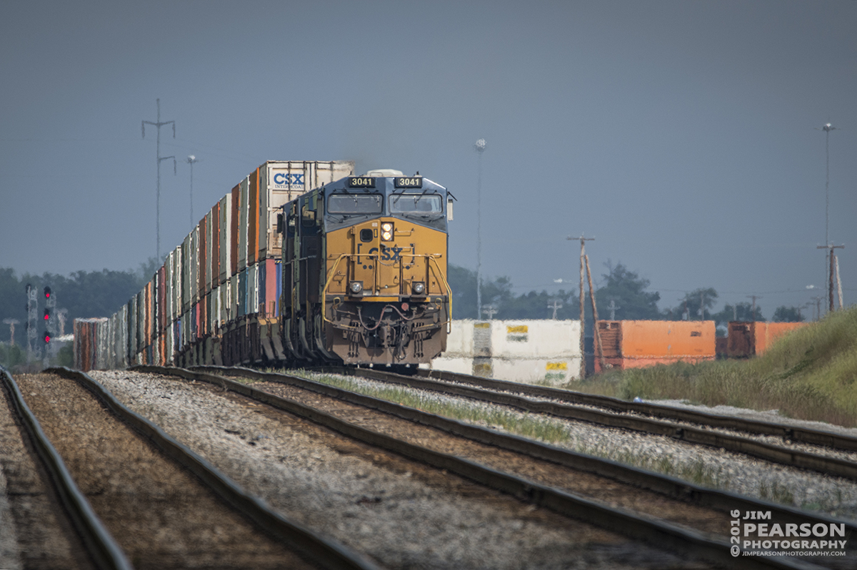 May 17, 2016 - The sun pops through the clouds just as CSX Q028-17 (Atlanta, GA - Chicago, IL) pulls out of Casky yard up the northbound lead at Hopkinsville, Ky as it heads north on the Henderson Subdivision with its priority intermodal train. - Tech Info: 1/800 | f/6.3 | ISO 280 | Lens: Sigma 150-600 @ 600mm on a Nikon D800 shot and processed in RAW.