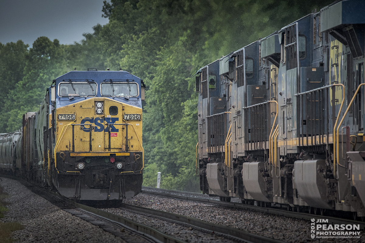 May 25, 2016 - Southbound CSX Q025-25 (Chicago, IL - Jacksonville, FL), right, passes northbound Q586 sitting in the siding at the north end of Slaughters siding, as the two trains meet in a light rain on the Henderson Subdivision at Slaughters, Ky. - Tech Info: 1/1250 | f/9 | ISO 3600 | Lens: Sigma 150-600 @ 450mm on a Nikon D800 shot and processed in RAW.