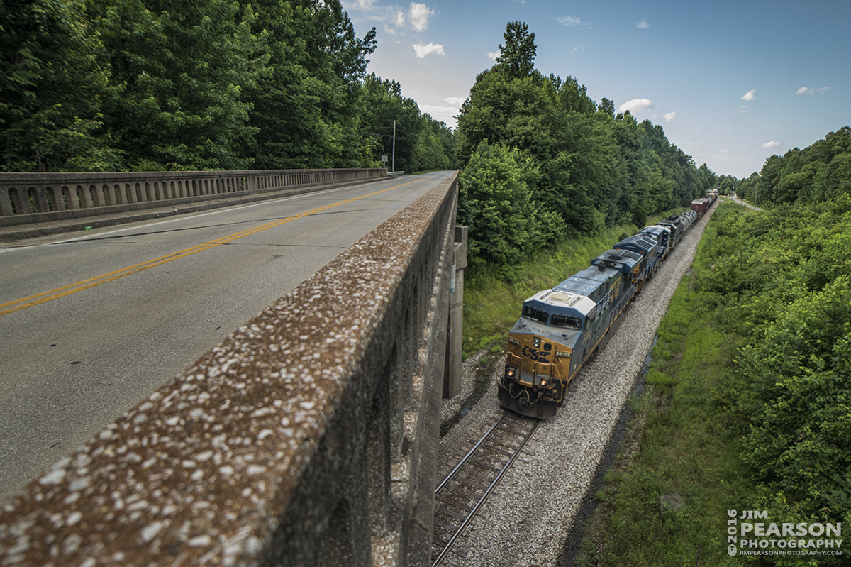 June 27, 2016  CSX daily manifest train Q645-27 (Chicago, IL (Barr Yard) - Nashville, TN) heads under the highway 41 bridge at Mortons Gap, Ky as it makes its way south on the Henderson Subdivision. - Tech Info: 1/2000 | f/2.8 | ISO 720 | Lens: Rokinon 14mm with a Nikon D800 shot and processed in RAW.