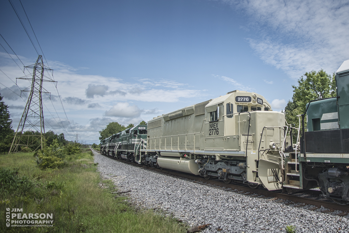 July 9, 2016  A Paducah and Louisville Railway coal train makes its way up the Warrior Coal lead with NREX 2776 as its 5th unit as it heads for a load of coal at their loadout at Madisonville, Ky. Near as I can tell it's a newly painted/primered GP38 High hood unit, ex-NREX 2776 ex-NS 2776 and ex-SOU 2776. - Tech Info: 1/2000 | f/2.8 | ISO 100 | Lens: Nikon 18mm with a Nikon D800 shot and processed in RAW.