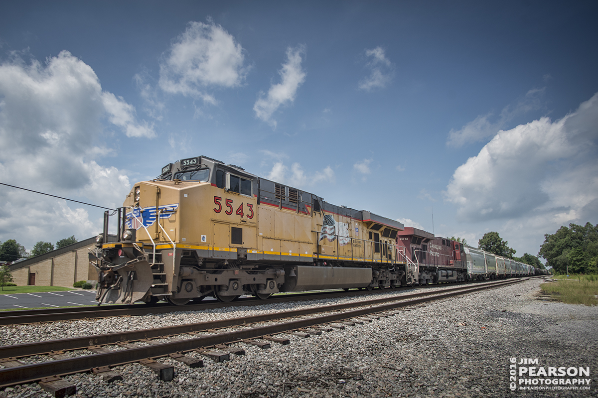 August 2, 2016  CSX S515-02, (Indianapolis, IN - Nashville, TN) with Union Pacific 5543 leading and Canadian Pacific 8813 trailing, passes through Hanson, Ky with its 10,000 foot train as it heads south on the Henderson Subdivision. - Tech Info: 1/1000 | f/6.3 | ISO 160 | Lens: Nikon 18mm with a Nikon D800 shot and processed in RAW.