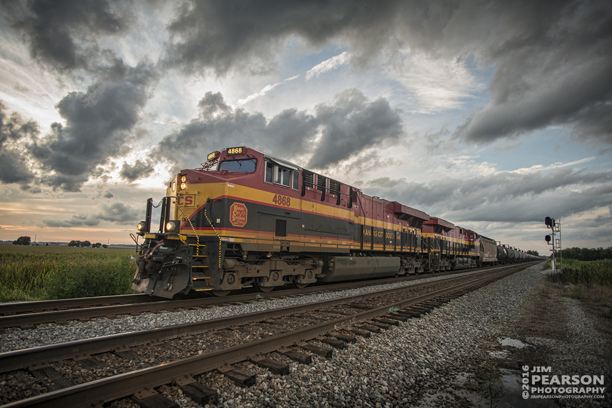 August 20, 2016 - CSX K443, with Kansas City Southern 4868 and 4830 leading the way, approach the crossing at County Road 550 at Middle King just outside of Ft. Branch, Indiana at dusk as it makes its way south with a loaded Ethanol Train on the CE&D Subdivision.