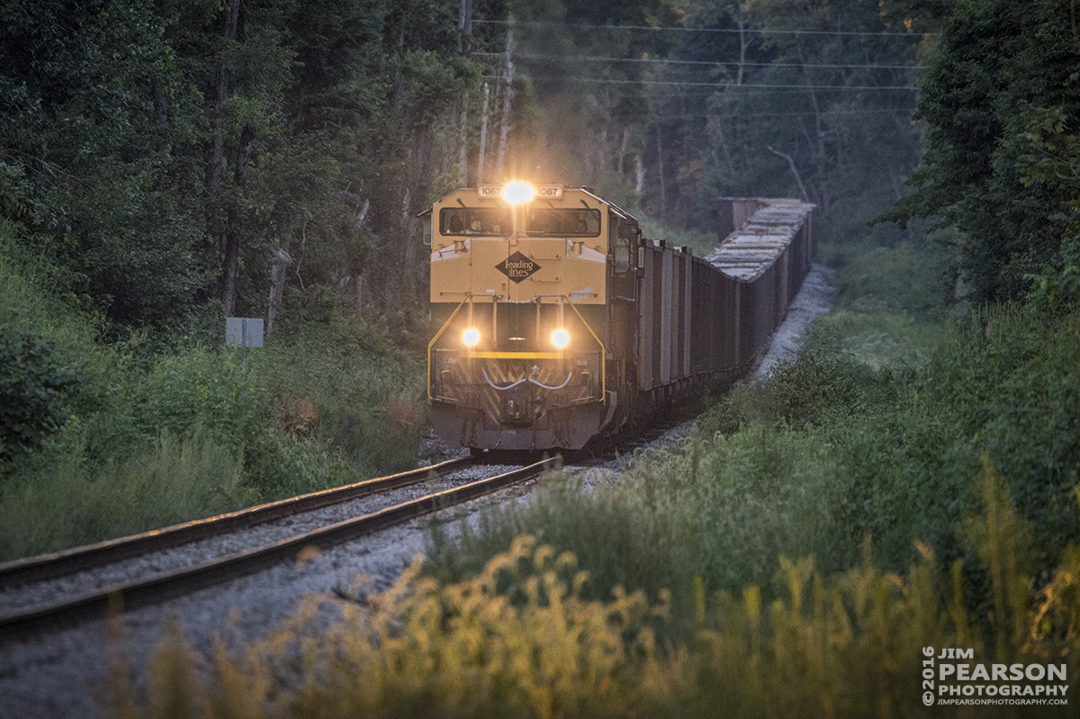 August 22, 2016 - Norfolk Southern Heritage Unit 1067, "Reading Lines" makes it's way up a slight grade on the Indiana Railroad as it approaches the connection at Sullivan, Indiana to CSX's CE&D Subdivision where it continued south to Oaktown, IN to pickup a load of coal.