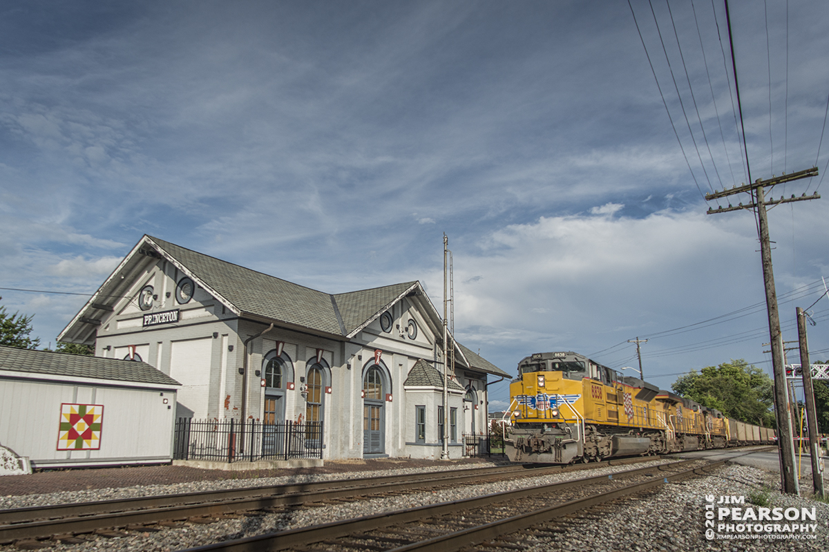 August 20, 2016 - CSX E050-16 coal train approaches the station at Princeton, Indiana, with a set of Union Pacific engines leading the way, as it heads north on CSX's CE&D Subdivision. The depot was built in 1875 and has been beautifully restored and is the only remaining depot structure in Gibson County. It once housed the C&EI and L&N railways and is now home to the Gibson County Visitors Center and features a railway museum with a restored train caboose.