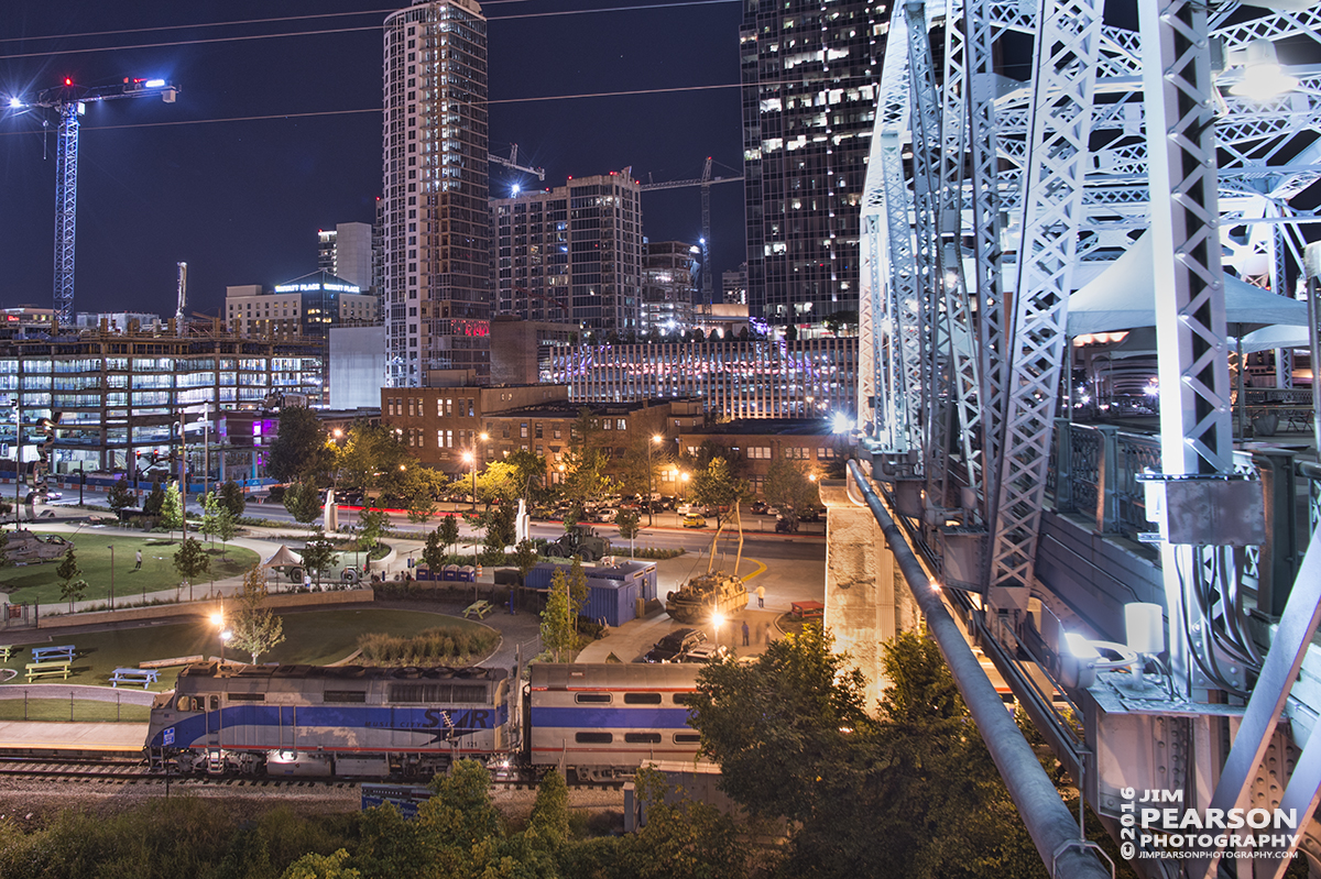 September 9, 2016 - A Music City Star commuter train with engine 121 (F40PH), sits along the river front in downtown Nashville, Tennessee, from the John Seigenthaler Pedestrian Bridge.