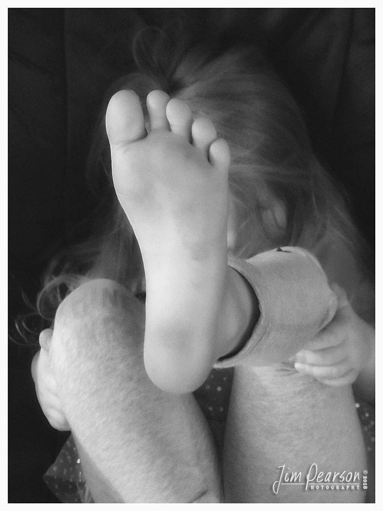 November 5, 2018 - Day 371 - iPhone 7 Plus Daily B/W Photo Challenge - Photograph the foot - Today's portrait is of my niece Elaina! Well, sort of! I tried to get my portrait today of my niece Elaina and she just wasn't in the mood, so this is what I ended up with! I still love it as it is so her!! Don't worry about not being conventional in your portrait work as it will allow you to have more storytelling images sometimes! Think outside the box!