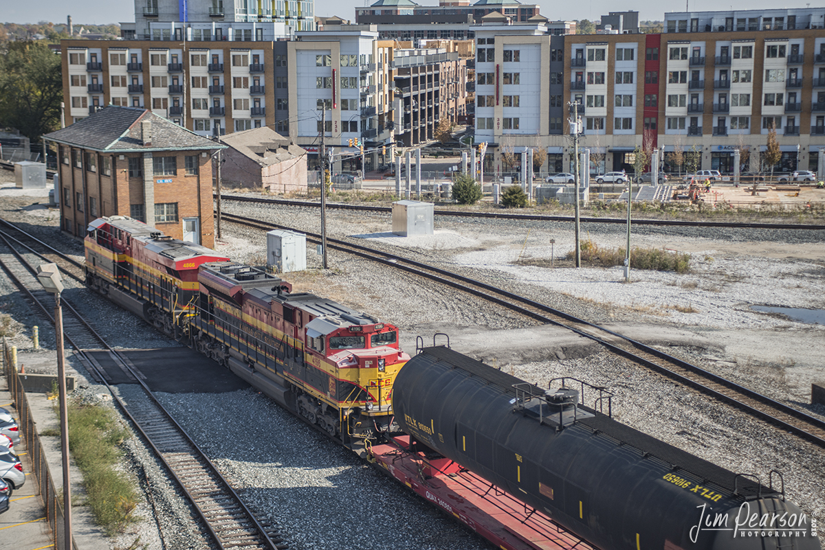 November 3, 2018 - A CSX mixed freight, carrying a tank car on a flat, with Kansas City Southern 4866 and 4198 leading, pass the I.U. Interlocking tower as it east on the Indianapolis Terminal Subdivision at Indianapolis, Indiana. - #jimstrainphotos #indianarailroads #trains #nikond800 #railroad #railroads #train #railways #railway #csx #csxrailroad