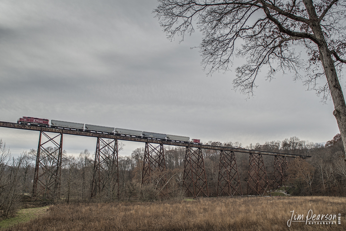 November 23, 2018 - The Indiana Railroad 3803 leads a short freight (The Bloomington Turn) with INRD 31687 caboose bringing up the rear as it heads across the Tulip Trestle at Solsberry, Indiana. 

According to Wikipedia: The Tulip Viaduct is a 2,295-foot  long railroad bridge (also known as the Greene County Viaduct or Tulip Trestle, and officially designated Bridge X76-6) in Greene County, Indiana, that spans Richland Creek between Solsberry and Tulip. According to Richard Simmons and Francis Haywood Parker, authors of Railroads of Indiana, it is "easily the state's most spectacular railroad bridge". The bridge was built in 1905 and 1906 by the Indianapolis Southern Railway and successor Indianapolis Southern Railroad, which became part of the Illinois Central Railroad in 1911. It is now part of the IndianapolisNewton, Illinois, line of the Indiana Rail Road. - #jimstrainphotos #indianarailroads #trains #nikond800 #railroad #railroads #train #railways #railway #inrd #indianarailroad