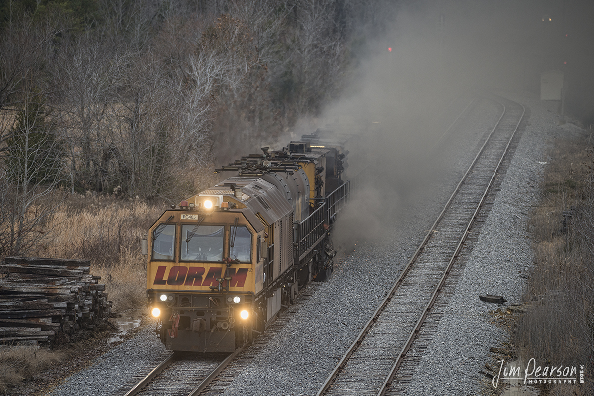 November 29, 2018 - LoRam Railgrinder 405  is surrounded with dust as it grinds just past the switch at the north end of the Dawson Springs, Siding, as it works south on the Paducah and Louisville Railway, at Dawson Springs, Ky. - #jimstrainphotos #kentuckyrailroads #trains #nikond800 #railroad #railroads #train #railways #railway #pal #railgrinder #loram