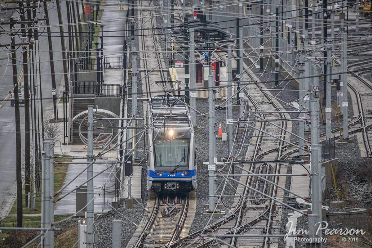 January 13, 2019 - A Charlotte, NC LYNX Blue Line Commuter train pulls away from the 25th Street light rail station, under a maze of power lines, as it heads north to its final stop at the I-485 station. According to Wikipedia, 25th Street is a light rail station on the LYNX Blue Line in the Optimist Park neighborhood of Charlotte, North Carolina, United States. It opened on March 16, 2018, as part of the Blue Line extension to the UNC Charlotte campus. The station features an island platform and is located at the southern end of NoDa. - #jimstrainphotos #NCrailroads #trains #nikond800 #railroad #railroads #train #railways #railway #commutertrain #lightrail #northcarolinarailroads