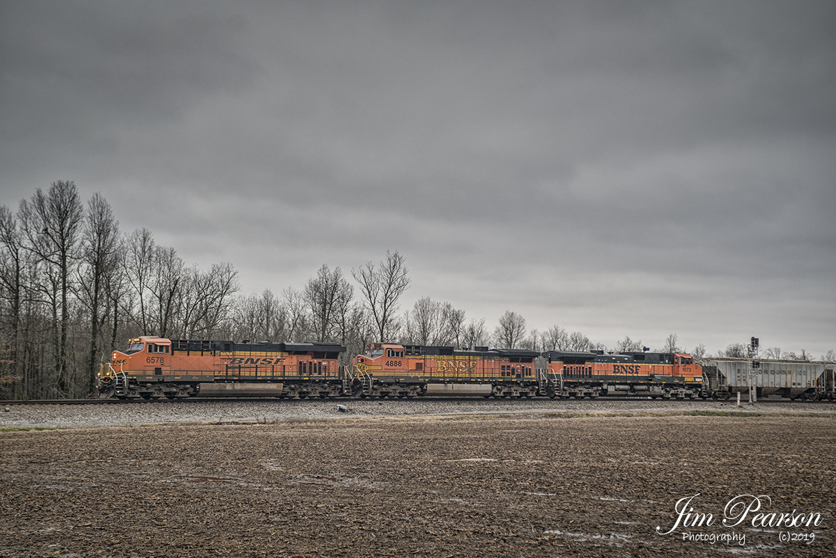 December 21, 2018 - CSX Q647, with 3 different paint schemes, BNSF 6578 ES44C4 in H3 paint, BNSF 4886 Dash 9 in H2 paint and BNSF 1073 dash 9 in H1 paint, passes the signals at the south end of Breton siding as it heads south on the Henderson Subdivision at Breton, Ky. - #jimstrainphotos #kentuckyrailroads #trains #nikond800 #railroad #railroads #train #railways #railway #csx #csxrailroad