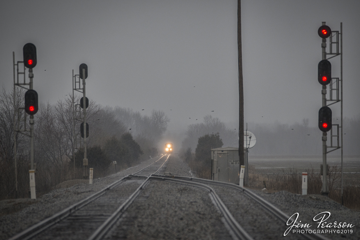 February 23, 2019 - CSX grain train G235-22 heads toward the north end of Slaughters, through the falling rain, as it heads south on the Henderson Subdivision at Slaughters, Kentucky. I love the ability my 150-600 mm Sigma lens gives me to pull subjects in close, even though they are far away. This is at 400mm from the crossing, which gave me plenty of time to get my shot and move safely out of the way. Train photos don't always have to be 3/4 view and close-up! Wide and long shots can be just as effective. I think the key here is trying to get something different when you're out shooting. That's why when I'm out railfanning, I'm ready to move somewhere else after I've got a train or two at the same spot. Variety makes for more interesting photos! - #jimstrainphotos #kentuckyrailroads #trains #nikond800 #railroad #railroads #train #railways #railway #csx #csxrailroad