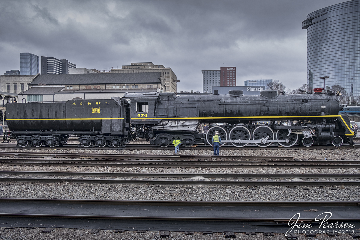 March 9, 2019 - NC&StL Steam Locomotive sits under stormy skies in downtown Nashville, TN, as workers inspect it after stopping for a display at Union Station. After several hours on display the locomotive was then towed on its own wheels to the restoration facility at the Tennessee Central Railway Museum, where it will undergo and estimated two years of restoration. The Nashville, Chattanooga and St. Louis Railway was a railway company operated in the southern United States in Kentucky, Tennessee, Alabama and Georgia. It began as the Nashville and Chattanooga Railroad, chartered in Nashville in December 11, 1845, built to 5 ft (1,524 mm) gauge and was the first railway to operate in the state of Tennessee. By the turn of the twentieth century, the NC&StL grew into one of the most important railway systems in the southern United States. Visit http://www.nashvillesteam.org/ to find out more information and how you can help support this endeavor. - #jimstrainphotos #tennesseerailroads #trains #nikond800 #railroad #railroads #train #railways #railway #csx #csxrailroad #NCSL576 #steamlocomotive