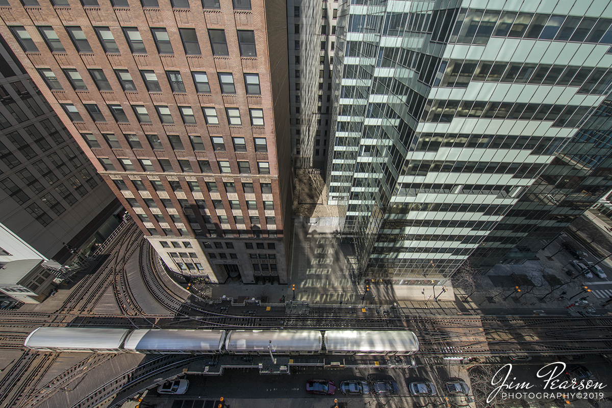 March 23, 2019 - A Chicago Transit Authority Rapid transit L train passes through the tower 18 interlocking in downtown Chicago, Illinois. For decades, the Tower 18 junction at Lake & Wells has been billed as one of the busiest railroad junctions in the world.

According to Wikipedia, The Chicago L (short for elevated) is the rapid transit system serving the city of Chicago and some of its surrounding suburbs in the U.S. state of Illinois. It is operated by the Chicago Transit Authority (CTA). It is the fourth-largest rapid transit system in the United States in terms of total route length, at 102.8 miles (165.4 km) long, and the second-busiest rail mass transit system in the United States, after the New York City Subway.

Chicagos L provides 24-hour service on some portions of its network, being one of only six rapid transit systems in the United States to do so. The oldest sections of the Chicago L started operations in 1892, making it the second-oldest rapid transit system in the Americas, after New York Citys elevated lines.

The L has been credited with fostering the growth of Chicagos dense city core that is one of the citys distinguishing features. The L consists of eight rapid transit lines laid out in a spoke-hub distribution paradigm focusing transit towards the Loop. Although the L gained its name because large parts of the system are elevated, portions of the network are also in subway tunnels, at grade level, or open cut. - #jimstrainphotos #illinoisrailroads #trains #nikond800 #railroad #railroads #train #railways #railway #cta #thechicagol #chicago