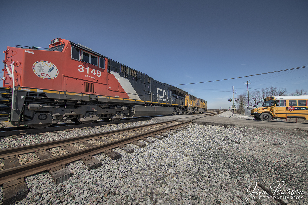 March 27, 2019 - CSX Q028-26 (Atlanta, GA - Chicago, IL) pulls through the crossing at the north end of Slaughters Siding, with Union Pacific 4011 and Canadian National 3149 as power, as it heads north at Slaughters, Ky on the Henderson Subdivision. - #jimstrainphotos #kentuckyrailroads #trains #nikond800 #railroad #railroads #train #railways #railway #csx #csxrailroad