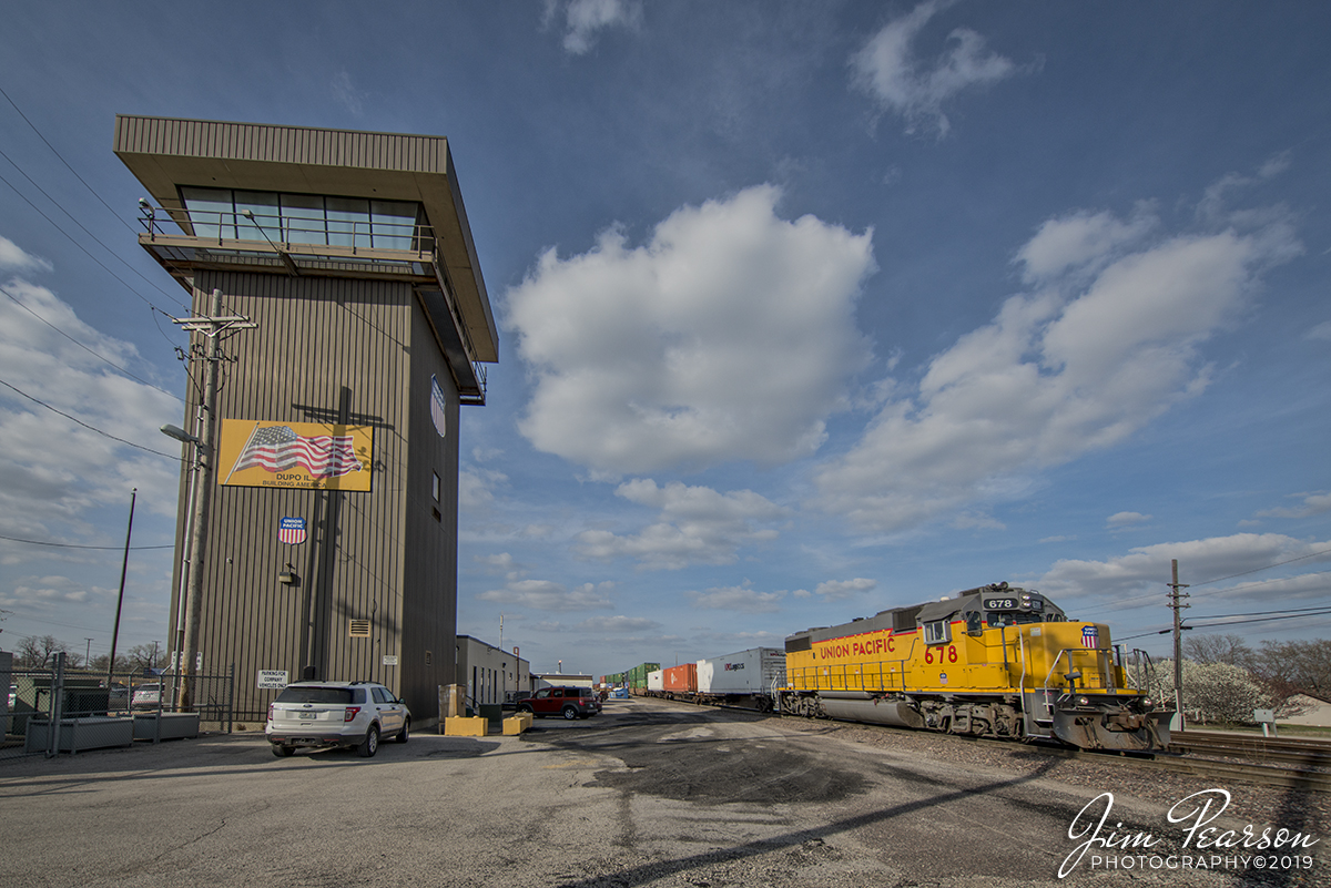 April 6, 2019 - Union Pacific 678, GP38-2, heads up YDU21 (Y-Yard DU-Dupo 2-2nd Shift 1-Ramp Job) uses the Material Track at the UP yard in Dupo, Illinois as it passes the tower while building an intermodal train. YDU21 pulls and spots intermodal cars on the ramp and builds two outbound trains, one for North Platte, NE (IDUNP) and points beyond and second train is UPS for Mesquite, TX (ZDUMQ). - #jimstrainphotos #illinoisrailroads #trains #nikond800 #railroad #railroads #train #railways #railway #unionpacific #dupoillinois #uptrain