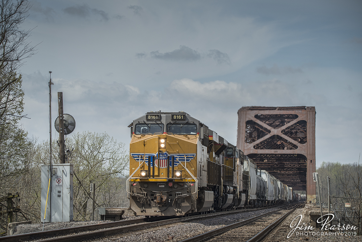 April 6, 2019 - Union Pacific 8161 leads a mixed freight over the Mississippi River on the Thebes Bridge at Thebes, Illinois as it makes its way south on UP's Chester Subdivision. 

According to Wikipedia: The Thebes Bridge is a truss bridge carrying the Union Pacific Railroad (previously carried the Missouri Pacific and Southern Pacific, in a joint operation) across the Mississippi River between Illmo, Missouri and Thebes, Illinois. It is owned by the Southern Illinois and Missouri Bridge Company, now a UP subsidiary. 

The Southern Illinois and Missouri Bridge Company was incorporated in Illinois on December 28, 1900 to own the bridge and 4.64 miles (7.47 km) of connecting rail line. It was initially owned equally by the Chicago and Eastern Illinois Railroad, Illinois Central Railroad, Missouri Pacific Railway, St. Louis, Iron Mountain and Southern Railway, and St. Louis Southwestern Railway. 

The designer of the bridge was Polish-American engineer Ralph Modjeski. The Missouri Pacific and SLIM&S merged in 1917, and in 1945 the C&EI sold its 1/5 share to the Missouri Pacific, giving the latter company, since merged into the UP, a majority interest. - #jimstrainphotos #illinoisrailroads #trains #nikond800 #railroad #railroads #train #railways #railway #uprailroad #unionpacific