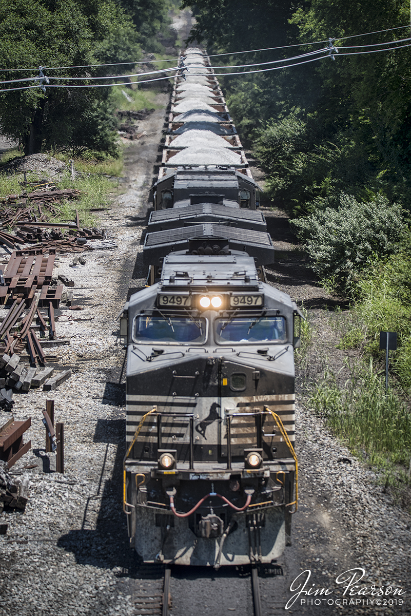 July 13, 2019 - NS 9497 heads up loaded rock train D51 as it makes its way along the Duke Energy's Gibson Power Plant lead to deliver the rock to the plant at East Mt. Carmel, Indiana.