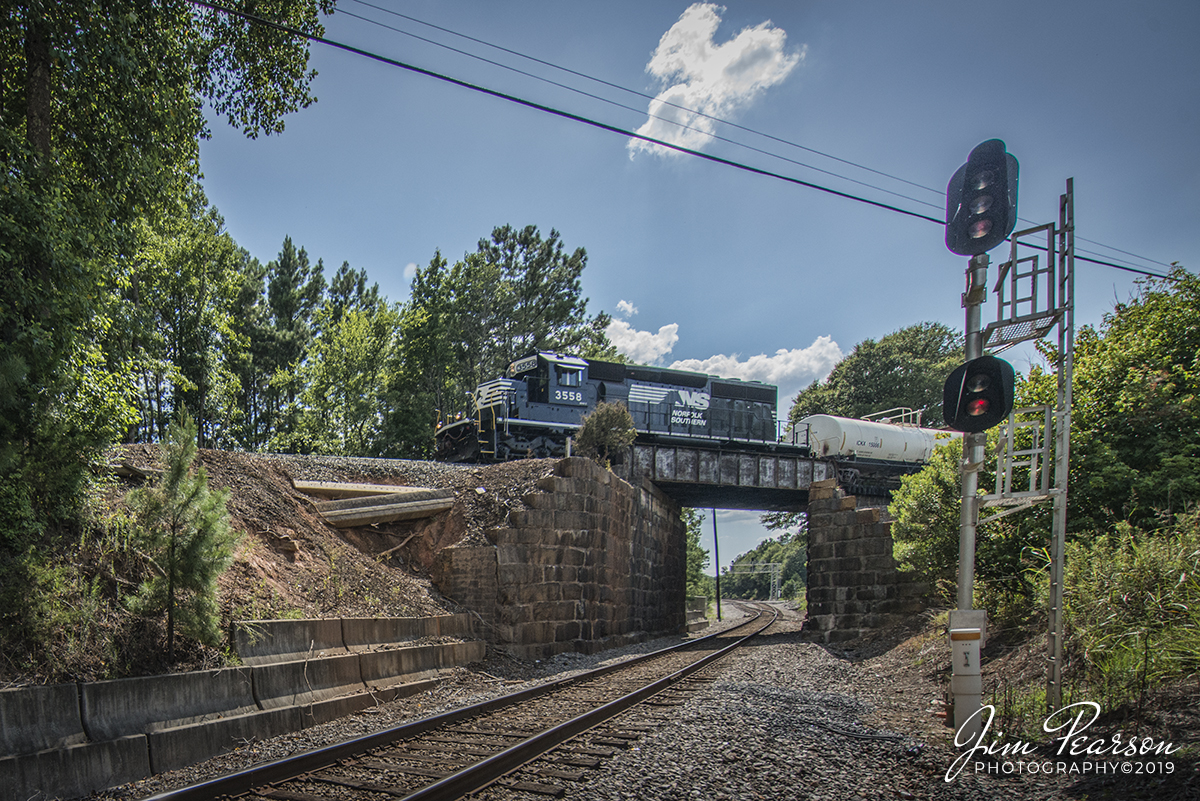 July 24, 2019 - NS 3558 leads local P83 over the CSX Monroe Subdivision at Catawba, South Carolina as it heads to the RJ Corman Yard at Catawba on the NS SB Line.