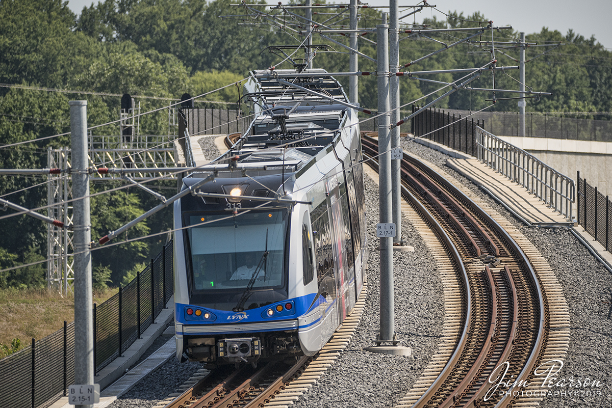 July 25, 2019 - A Charlotte Area Transit System Blue line LYNX train heads downgrade as it approaches the 25th Street Station in Charlotte, North Carolina as it heads uptown.

According to Wikipedia... The Lynx Blue Line is a light rail line in Charlotte, North Carolina. The 19.3-mile (31.1 km) line goes from its northern terminus at the University of North Carolina at Charlotte in University City through NoDa, Uptown, and South End then paralleling South Boulevard to its southern terminus just north of Interstate 485 at the Pineville city limits. 

There are 26 stations in the system, the light rail portion of which carries an average of over 23,200 passenger trips every day. It is the first major rapid rail service of any kind in North Carolina, and began operating seventy years after the previous Charlotte streetcar system was disbanded in 1938, in favor of motorized bus transit. 

It opened on November 24, 2007 between I-485/South Boulevard and 7th Street as the first rail line of the Charlotte Area Transit System. Fares were not collected as part of the opening celebration. Regular service with fare collection commenced the next day.