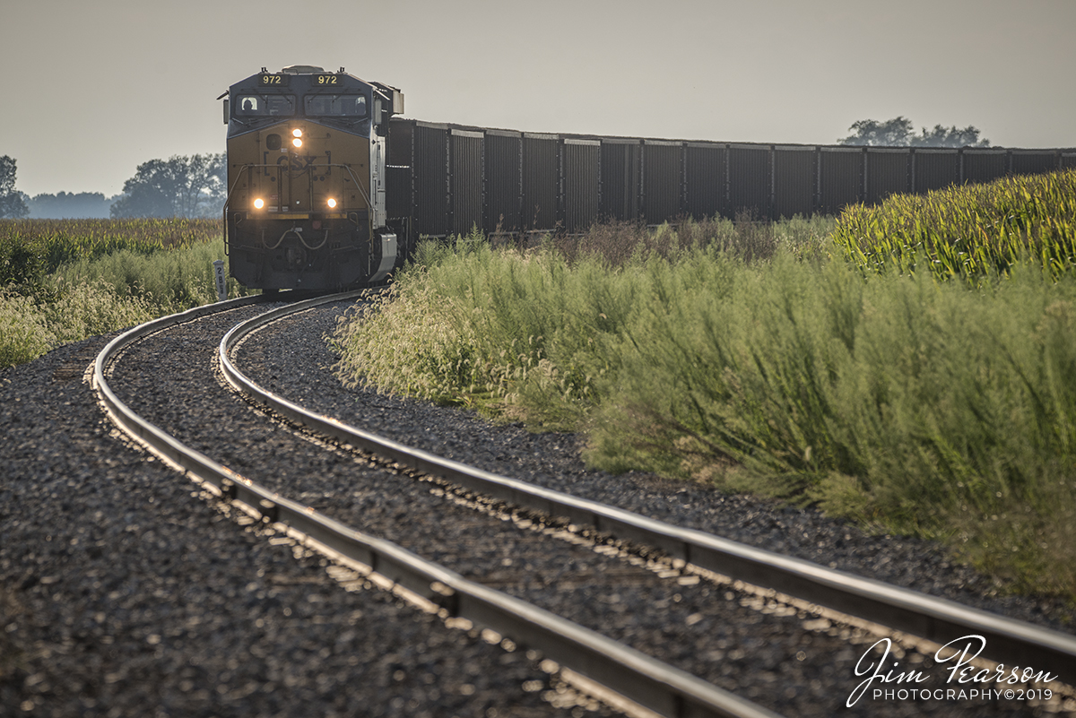 August 17, 2019 - CSXT 972 leads a load of 75 coal cars on J800-16 as they round the curve coming approaching the Happy Lane Crossing on the Morganfield Branch at Manitou, Kentucky. This one of the last trains to pickup a load of coal from Dotki Mine in Clay, Ky since it ceased operations on August 14th, 2019.