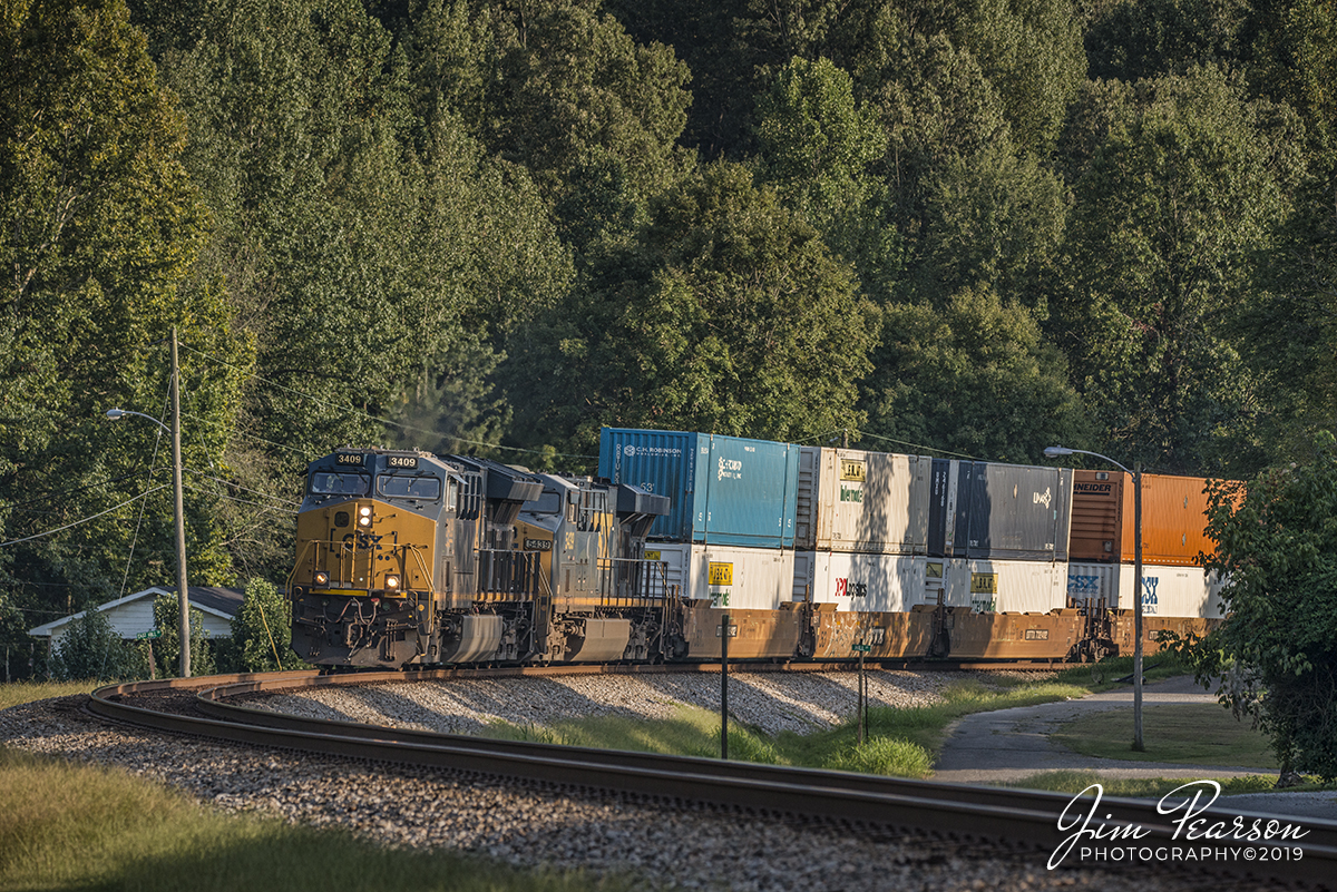 August 19, 2019 - CSX intermodal Q026-18 rounds the curve as they head north through Mortons Gap, Kentucky on the Henderson Subdivision with CSXT 3409 leading the way.