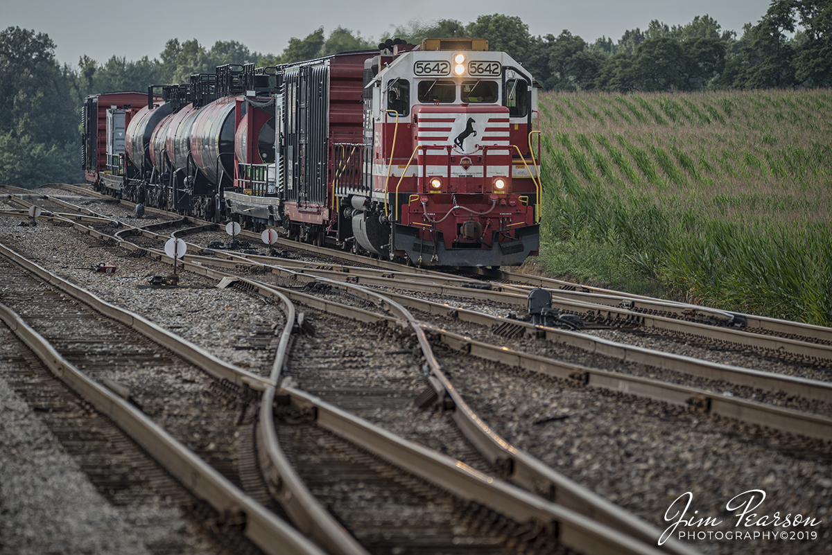 August 31, 2019 - Norfolk Southern 975 departs Princeton, Indiana with NS 5642 "Training First Responders" unit pulling the Norfolk Southern Safety Train east on the NS Southern-East District at East Junction.

According to their website: At Norfolk Southern, safety is our number one priority. Operation Awareness & Response (OAR), was launched in 2015 to educate the public about the economic importance of the safe movement of hazardous materials by rail and to connect emergency first responders in Norfolk Southern communities with information and training resources.

The goal of OAR is to strengthen relationships with the first responders across the NS network. Norfolk Southern has been providing safety training for emergency responders through community outreach programs such as TRANSCAER® for years. OAR will build on those efforts focusing on closer relationships with local and state agencies, increased training opportunities (classroom, web-based, and on-line resources), table-tops drills and participation in full-scale exercises, and providing better resources for emergency responders such as the AskRail mobile app that allows and first responders to use their mobile phones to look up commodity and response information on shipments.

The OAR program also includes a continued commitment to providing emergency responders high-level training at the Security and Emergency Response Training Center (SERTC) in Pueblo, Co. In April 2016, Norfolk Southern unveiled a brand new safety train, with a dedicated locomotive, specially equipped classroom box cars, and several tanks cars for additional hands-on training along our lines.