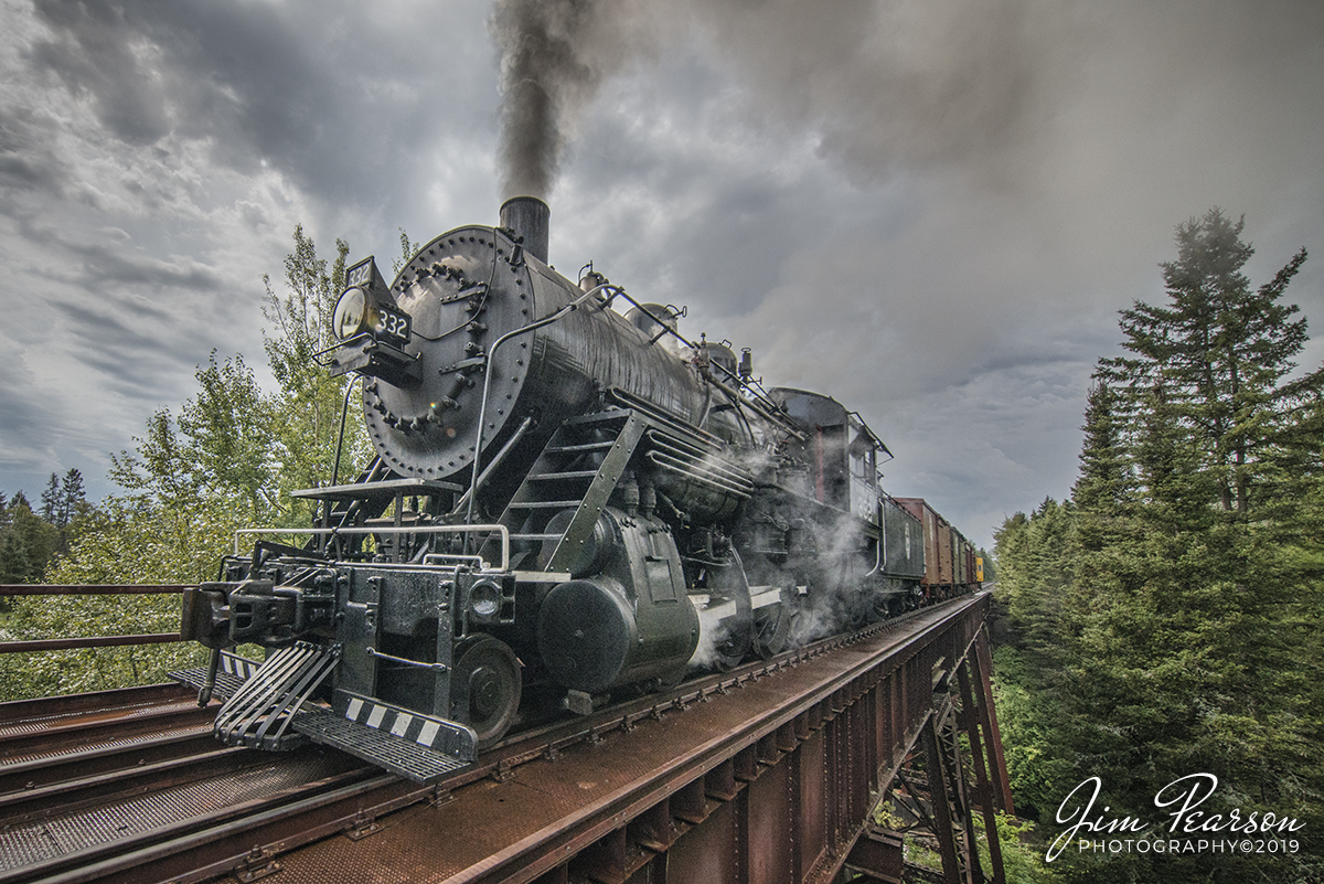 September 5, 2019 - The Duluth, Missabe & Iron Range 332 steam locomotive from the Lake Superior Railroad Museum passes over the Big Sucker Creek Trestle, on the North Shore Line, as it pulls a photo excursion freight train north toward Twin Harbors from Duluth, Minnesota.

According to Wikipedia: Duluth & Northeastern 28 (also known as Duluth, Missabe & Iron Range 332) is a restored 2-8-0 (consolidation) locomotive built in 1906 by the Pittsburgh Works of American Locomotive Company in Pittsburgh, Pennsylvania. It was restored to operating condition by the Lake Superior Railroad Museum from 2011-2017, and now operates in excursion service on the North Shore Scenic Railroad.