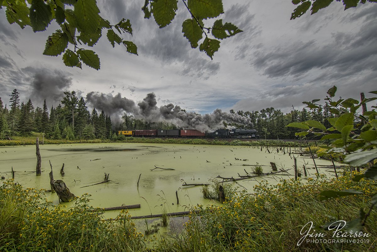 September 5, 2019 - The Duluth, Missabe & Iron Range 332 steam locomotive from the Lake Superior Railroad Museum passes a small pond under full steam at Palmers around MP 15.5 on the North Shore Line as it pulls a excursion freight train north toward Twin Harbors from Duluth, Minnesota.

According to Wikipedia: Duluth & Northeastern 28 (also known as Duluth, Missabe & Iron Range 332) is a restored 2-8-0 (consolidation) locomotive built in 1906 by the Pittsburgh Works of American Locomotive Company in Pittsburgh, Pennsylvania. It was restored to operating condition by the Lake Superior Railroad Museum from 2011-2017, and now operates in excursion service on the North Shore Scenic Railroad.