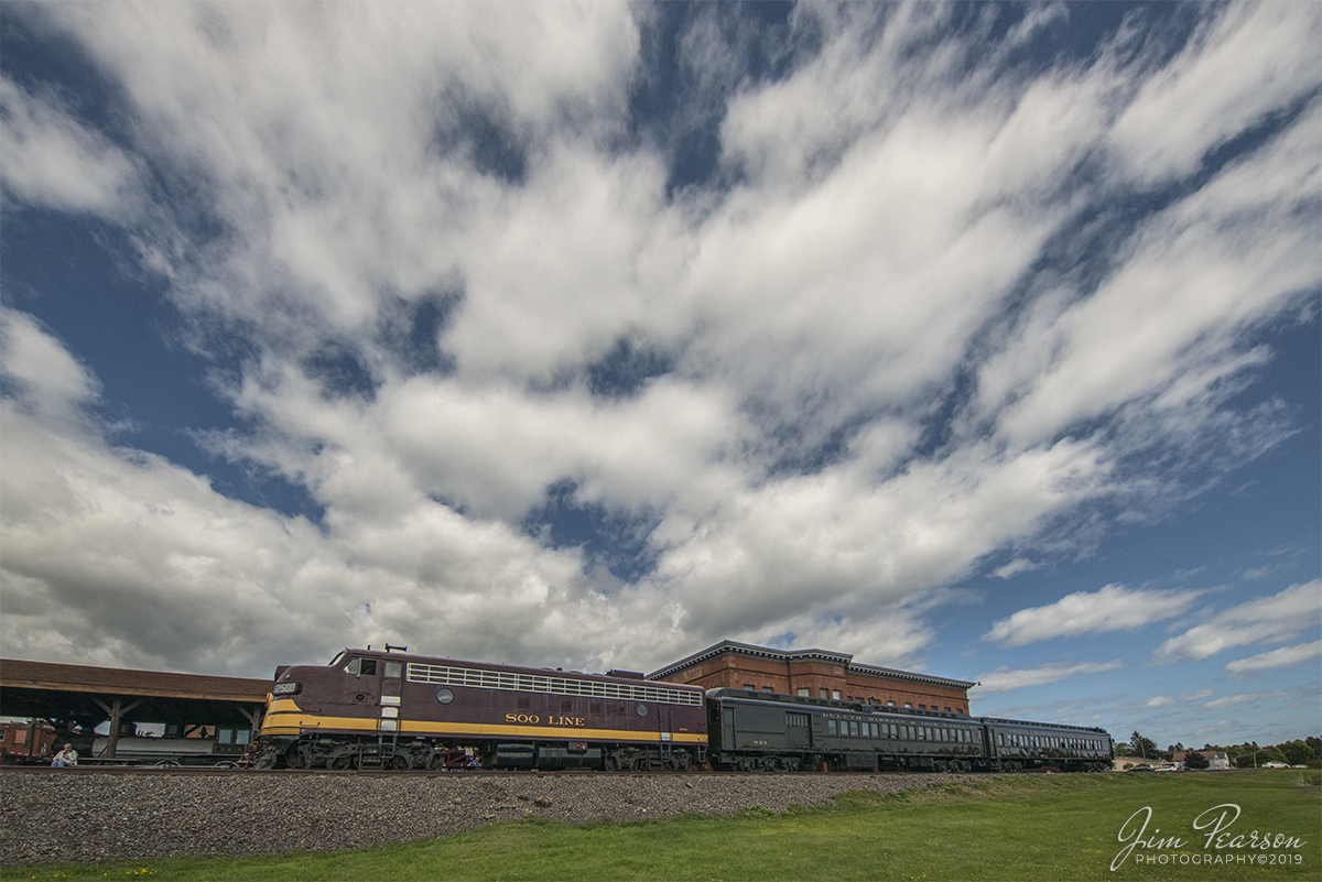 September 6, 2019 - Soo Line/Wisconsin Central FP7 Number 2500-A sits in the station at Two Harbors, Minnesota on the North Shore Scenic Railroad with a photo excursion passenger train.

According to Wikipedia: With steam operations on North American Railroads being converted to diesel operations, Electro-Motive, along with other locomotive builders, began building demonstrator units to be tested by various railroads. Electro-Motive built a set of three FP7 units, 7001 (A-unit) and 7002 & 7003 (B-units). In November 1949, Canadian Pacific Railway tested these units. Canadian Pacific owned most of the Soo Line, and after testing the three demonstrator units, they were sent to the Soo Line.

In April 1950, Soo Line ran the set from Minneapolis, MN to Portal, ND then Duluth, MN to Winnipeg. 7001 hosted the United Kingdom's Duke of Windsor, the former King Edward VIII, in its cab through North Dakota. Soo Line was so impressed with the set, that it purchased them for use on Wisconsin Central. In May 1950, they were delivered as WC 2500-A, 2500-B, and 2501-B.

WC 2500-A often pulled Soo's Laker from Chicago to Duluth. Although numbered as Wisconsin Central, 2500 was painted in Soo Line's maroon and gold scheme. In 1960 Wisconsin Central became part of the Soo Line, and 2500 was repainted into the red and gray Soo Line scheme. When passenger service was discontinued in the 1960s, 2500 was used to pull freight trains.