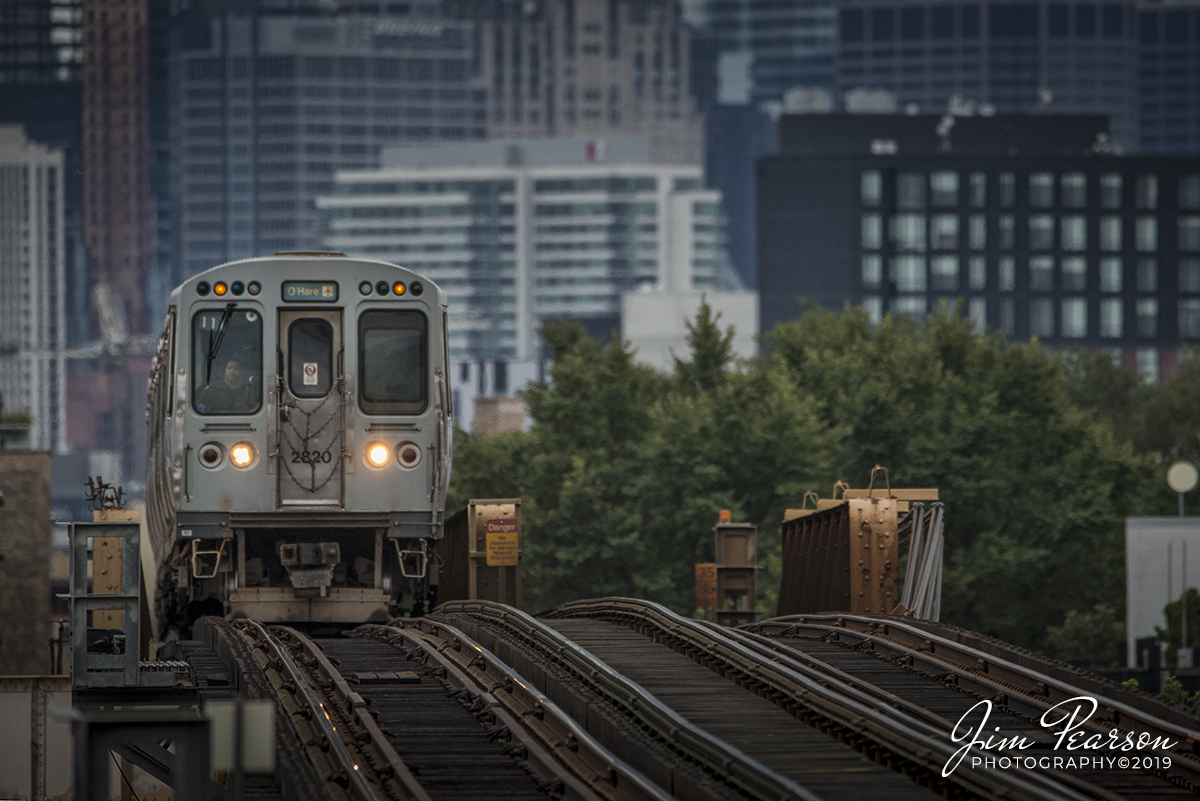 September 8, 2019 - CTA Blue Line train 117 crests a hill coming out of downtown Chicago, Illinois as it approaches the Damen Station, headed toward O'Hare airport.
