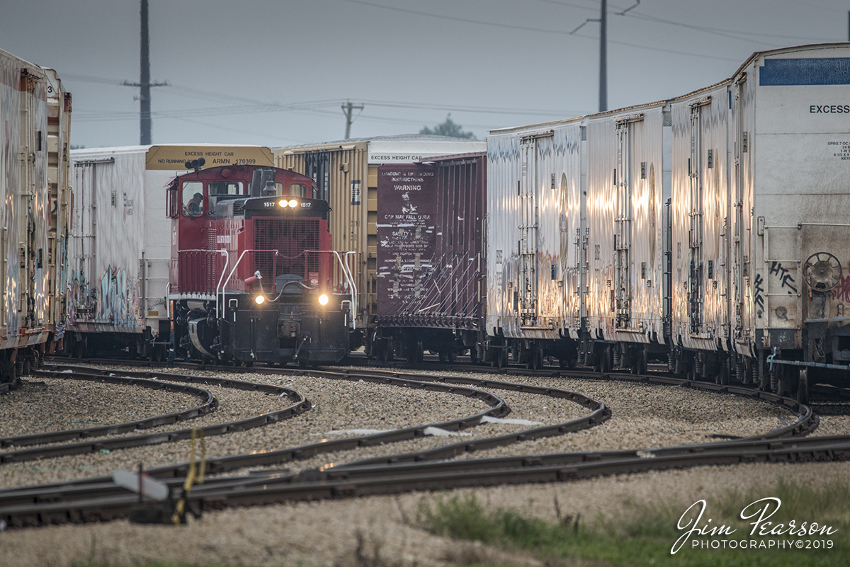 September 9, 2019 - Lights reflect off the side of refrigerated reefers as Burlington Northern Railway 1517 works on picking up and dropping off cars at the Americold plant in Rochelle, Illinois on the City of Rochelle Railroad.

According to Wikipedia: "The Burlington Junction Railway (reporting mark BJRY) is a Class III short line railroad which was chartered in 1985. Originally operating on the southernmost 3 miles (4.8 km) of the former Burlington, Cedar Rapids and Northern Railway mainline in Burlington, Iowa after abandonment by the Chicago, Rock Island and Pacific Railroad, it provides short freight hauling, switching operations, locomotive repair, and transloading services, the latter currently handling over 3,000 carloads a year. Typical commodity types transported include chemicals and fertilizer."

The BJRY operation in Rochelle is more sophisticated than most. First of all, the track is owned by the City of Rochelle Railroad. Second of all, it interchanges with UP as well as BNSF. It has enough track capacity to handle unit trains. It does not provide intermodal service because UP has its Global 3 intermodal yard on the other side of town.