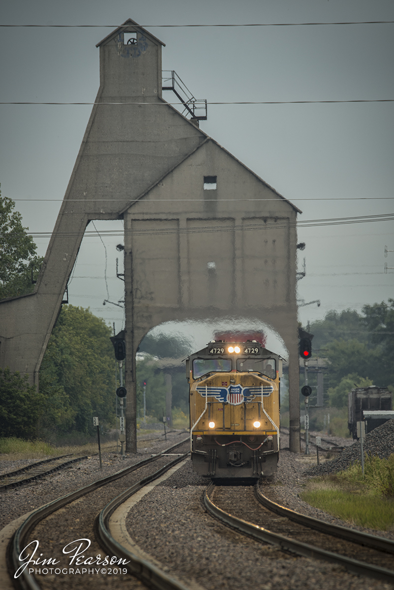 September 9, 2019 - A Union Pacific intermodal passes under the former Chicago and North Western Railway coaling tower, as it heads westbound on the Geneva Subdivision with UP 4729 leading at DeKalb, Illinois.