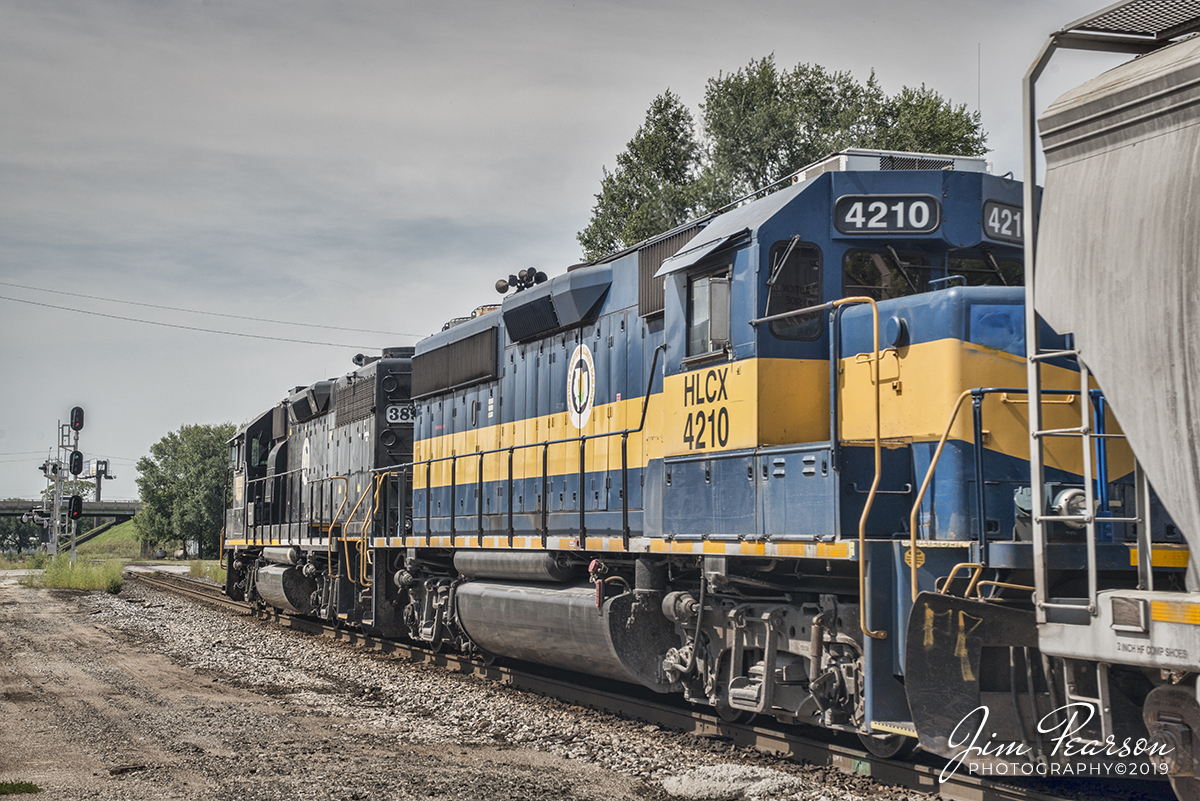 September 10, 2019 - Decatur & Eastern Illinois Railroad 3896 and 4210 approaches heads toward the crossing at 1st Street at Terre Haute, Indiana as it heads onto the Danville Secondary Subdivision with a mixed freight.

According to Wikipedia: The Decatur & Eastern Illinois Railroad (reporting mark DREI) is an American regional railroad that is a subsidiary of Watco Companies operating in eastern Illinois and western Indiana.

In January 2018, CSX Transportation announced that it was seeking offers to buy the Decatur Subdivision and the Danville Secondary Subdivision as part of a system-wide sale of low-traffic routes, and in July, Watco, via the DREI, was identified as the winning bidder. Following regulatory approval from the Surface Transportation Board, The DREI began operations on September 9, 2018.

The DREI operates two intersecting routes totaling 126.7 miles (203.9 km)the former Decatur Subdivision between Montezuma, Indiana and Decatur, Illinois, and the former Danville Secondary Subdivision between Terre Haute, Indiana and Olivet, Illinois. It interchanges traffic with CSX, the Eastern Illinois Railroad, the Norfolk Southern Railway, the Canadian National Railway, and the Union Pacific Railroad.The railroad is headquartered in Paris, Illinois.