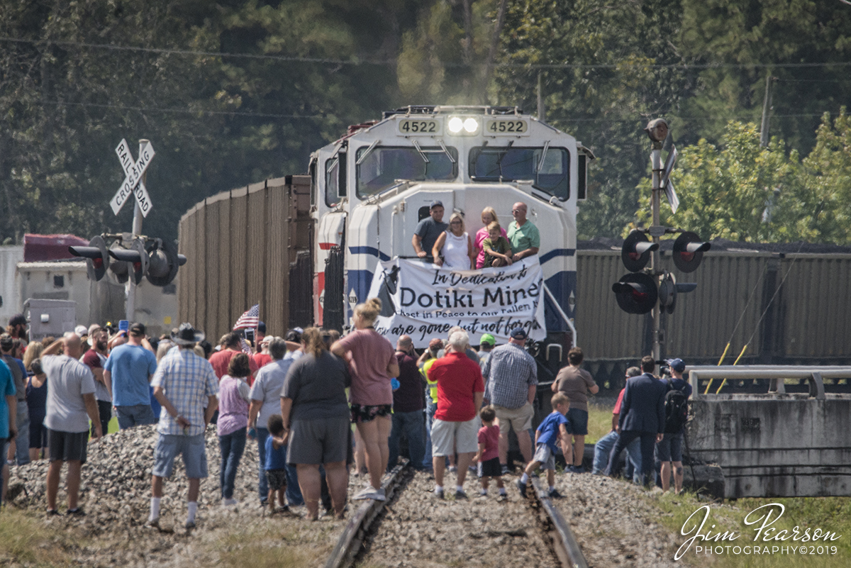 September 12, 2019 - It has been several weeks since Dotki Mine in Clay, Kentucky shut down and today the town of Providence, Ky turnout for the last load of coal (20 cars or so) from the mine. The last run today was dedicated in honor the miners who worked thereand the miner Jeremy Elderwho died just one week ago in an accident at Warrior Coal Mine outside Madisonville, Ky.

The  Elder family, from left, brother Adam Elder, wife Kristi Elder, mother Loretta Elder, son Holden Elder and father Terry Elder. Not pictured is son Rylan Elder,
who was on a field trip with his school, posing for pictures on Paducah and Louisville Railway's 4522, University of Kentucky engine, which was heading up CSX Z464-12 on the last trip along the CSX Morganfield Branch.

Coal trains have been passing through Providence since the 1800's according to a Facebook post by Providence Mayor Doug Hammers and a banner on the last coal car read; for the last 52 years the railroad has hauled a total of over 193 Million tons of coal from the Dotki Mine.

The mine was operated by Alliance Resource Partner's (ARP) subsidiary, Webster County Coal LLC and according to recent news reports by the Gleaner Newspaper in Henderson, Kentucky, the mine closed due to a decline in the coal market. "Unfortunately, weak market conditions made this action necessary," said Joseph W. Craft III, chairman, president and chief executive officer of ARP. "We are saddened that production will be ending at the Dotiki Mine, which was opened in 1969 and is the oldest mine operated by ARLP."