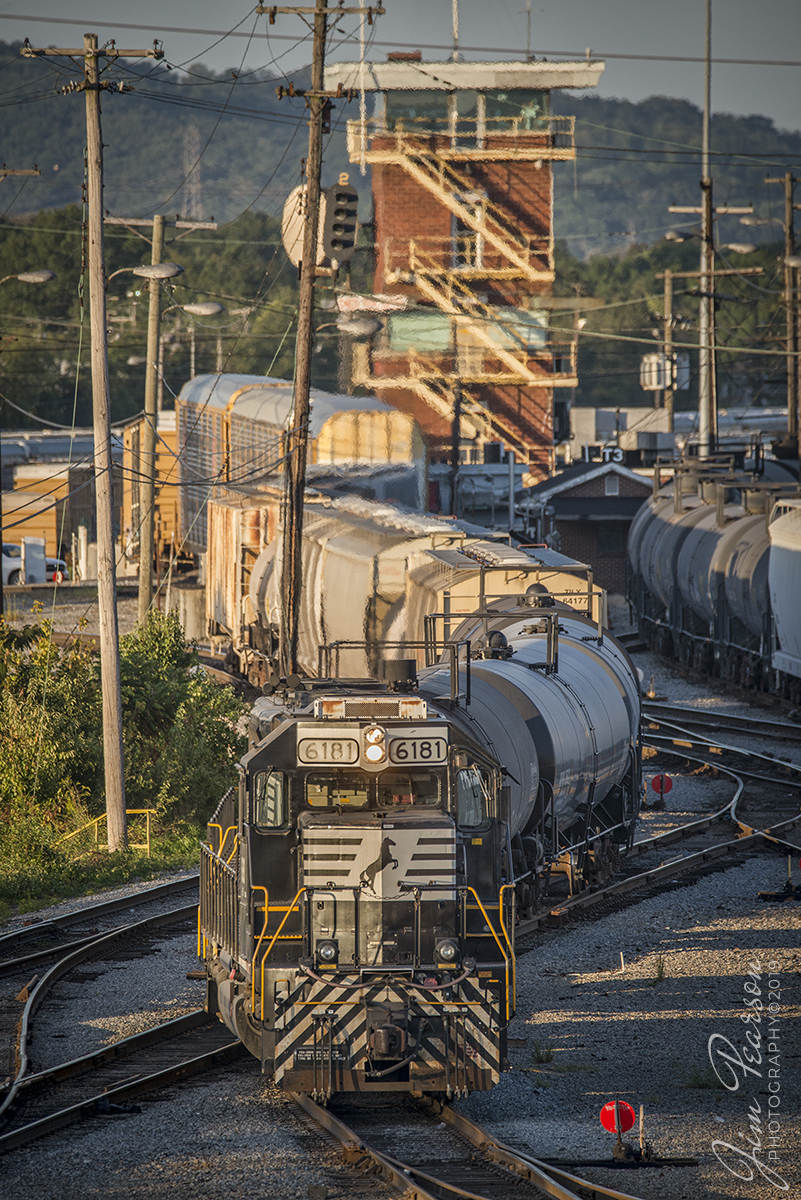 September 21, 2019 - Somewhere on the ground behind remotely controlled engine NS 6181 stands a remote operator that is working on building a train as one of the towers at NS DeButts Yard and the train is bathed in the late evening light at Chattanooga, Tennessee.