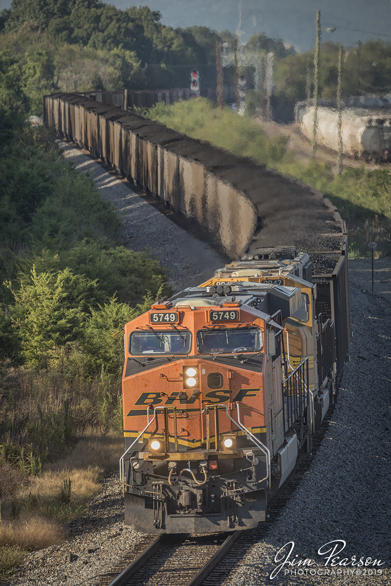 September 22, 2019 - The early morning sunlight bathes the nose of BNSF 5749 as it makes its way past NS DeButts Yard at Chattanooga, Tennessee with a loaded coal train as it heads along the CNO&TP Third District.

According to Wikipedia: The Cincinnati, New Orleans and Texas Pacific Railway (abbreviated: CNO&TP; (reporting mark CNTP)) is a railroad that runs from Cincinnati, Ohio, south to Chattanooga, Tennessee, forming part of the Norfolk Southern Railway system.

The physical assets of the road were initially financed by the city of Cincinnati in the 1870s, and are still owned by the city. It is the only such long-distance railway owned by a municipality in the United States. The CNO&TP continues to lease that property and operates one rail line, the Cincinnati Southern Railway, between Cincinnati and Chattanooga.