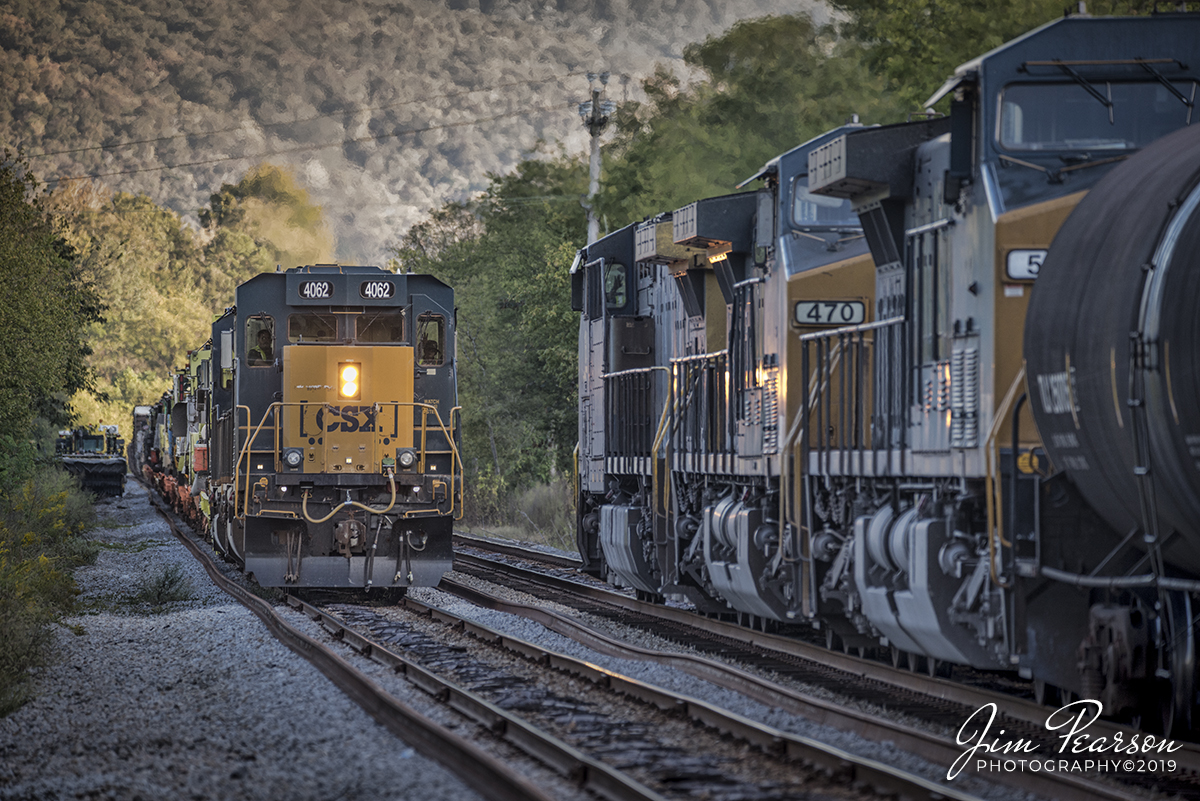 September 22, 2019 - CSX W032-17, with CSXT 4062 a SD40-3 leading, meets a northbound Q581 at Sherwood, Tennessee, as it heads north on the Chattanooga Subdivision with a load of MOW equipment.