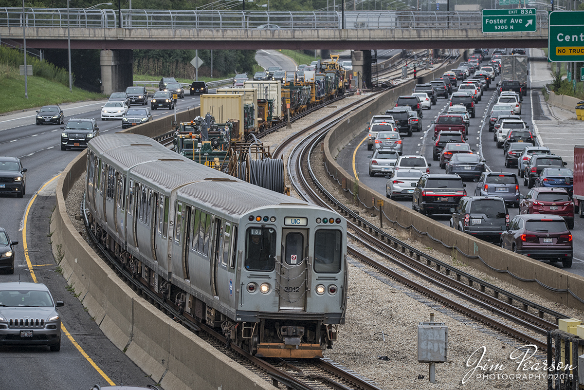 September 8, 2019 - CTA UIC-Halsted Blue Line train 108 passes a line of Maintenance of Way equipment as it heads into its next stop at Jefferson Park station in Chicago, Illinois.