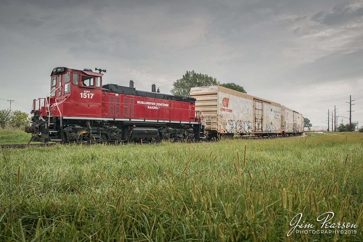 September 9, 2019 -  Burlington Junction Railway 1517 works a string of refrigerated reefers at the Americold plant in Rochelle, Illinois on the City of Rochelle Railroad.

According to Wikipedia: "The Burlington Junction Railway (reporting mark BJRY) is a Class III short line railroad which was chartered in 1985. Originally operating on the southernmost 3 miles (4.8 km) of the former Burlington, Cedar Rapids and Northern Railway mainline in Burlington, Iowa after abandonment by the Chicago, Rock Island and Pacific Railroad, it provides short freight hauling, switching operations, locomotive repair, and transloading services, the latter currently handling over 3,000 carloads a year. Typical commodity types transported include chemicals and fertilizer."

The BJRY operation in Rochelle is more sophisticated than most. First of all, the track is owned by the City of Rochelle Railroad. Second of all, it interchanges with UP as well as BNSF. It has enough track capacity to handle unit trains. It does not provide intermodal service because UP has its Global Three intermodal yard on the other side of town.