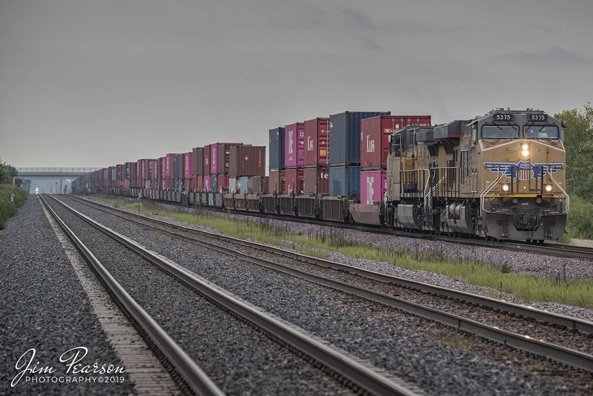 September 9, 2019 - Union Pacific 5375 leads stack train as it pulls westbound from UPs Global Three yard, on the Geneva Subdivision at Rochelle, Illinois.